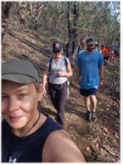 People walking a trail on a Tumbatrek 2025